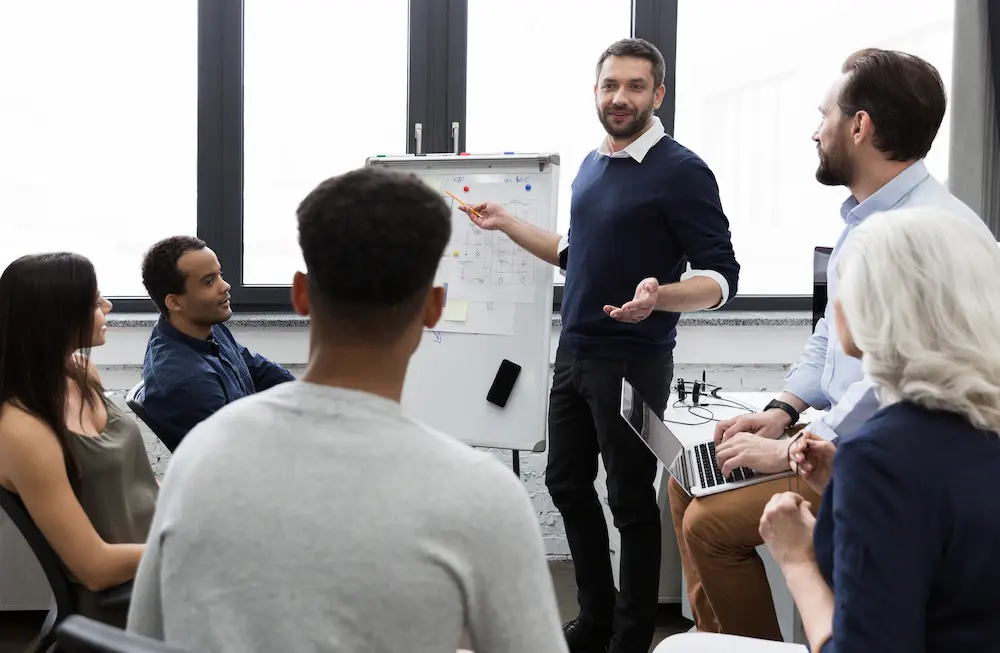 business-team-discussing-their-ideas-while-working-office